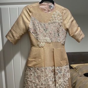 Rose good dress with lots of detail on it